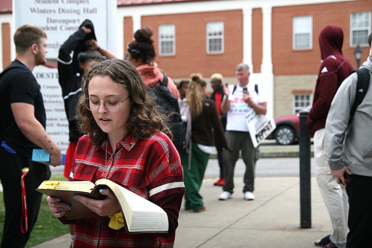 Student Caitlin McMann went to the protest with a Bible in hand and began counter-preaching and reading to a large group of students. “They are literally false shepherds,” she said. “It saddens me because we have people here who don’t believe, and if this is their first encounter with what they think Christians are like, how sad is that. It leads them in the wrong direction. This is why people hate Christians.”