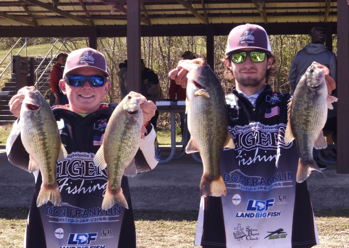 Logan Evans (left) and Ryan Lachniet (right) show off their biggest bass of the day during the Tigers’ win at the Kentucky Bass Nation State Championship recently, which sealed their ticket to nationals in May.