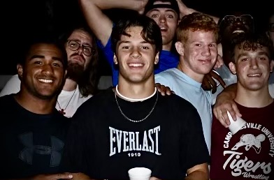 Josiah Malachi Kilman (center) was a freshman at CU. He was discovered unresponsive in his dorm room in the early morning hours on Saturday,
Feb. 24. A fellow CU classmate and wrestling teammate, Charles E. Escalera, has been charged with Kilmans murder.