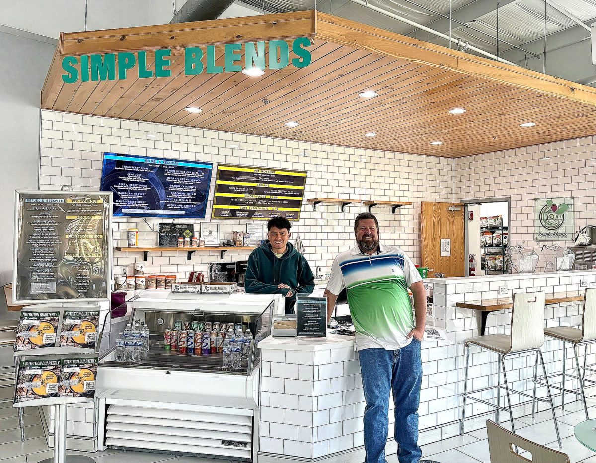 Brandon+Lakes+%28right%29+director+of+the+Betty+Dobbins+Heilman+Wellness+Center%2C+is+pictured+at+the+smoothie+bar%2C+Simple+Blends%2C+which+is+located+inside+the+facility.+It%E2%80%99s+equipped+with+new+products+and+high+protein+smoothies+for+students+to+consume+before+or+after+their+workouts.+Also+pictured+is+Miguel+Jaldin+who+works+at+Simple+Blends.