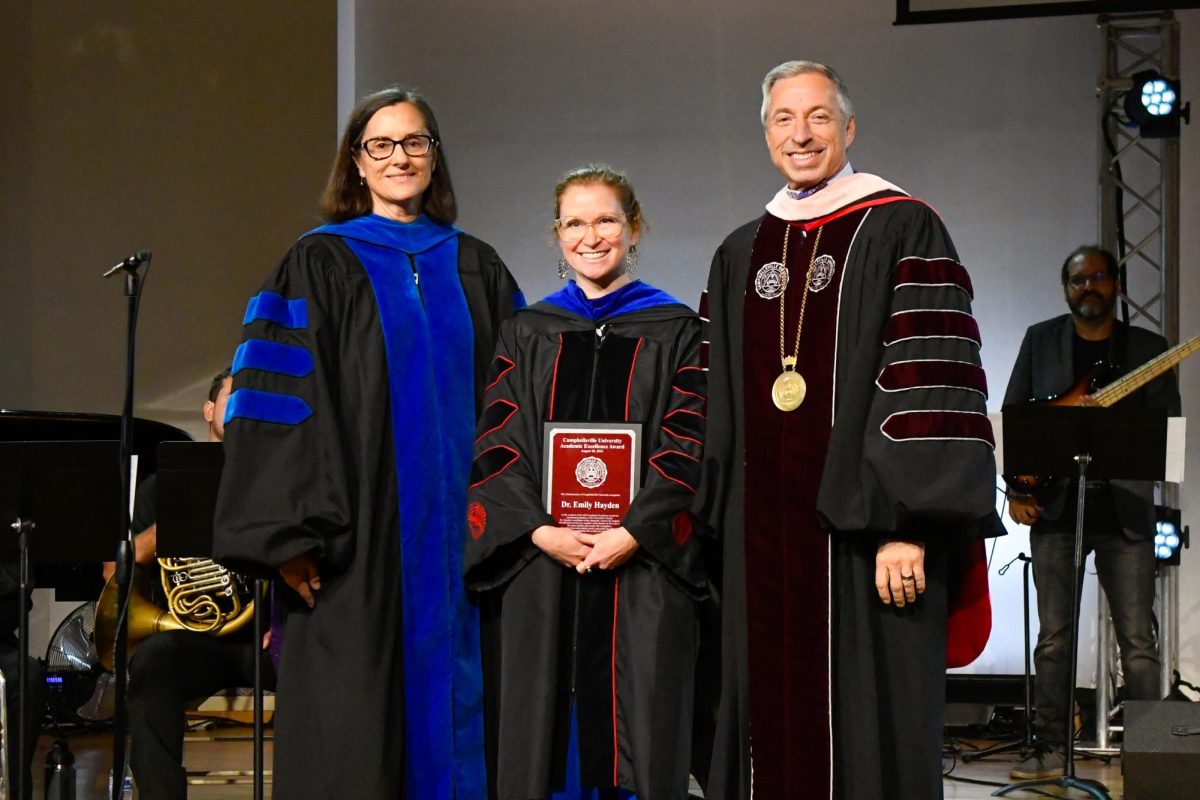 Dr. Emily Hayden, center, receives the 2024 CU Non-Tenured Faculty Award from Dr. Jeanette Parker, left, interim vice president for academic affairs, and CU President Dr. Joseph Hopkins.
(Photo/Gerard Flanagan)