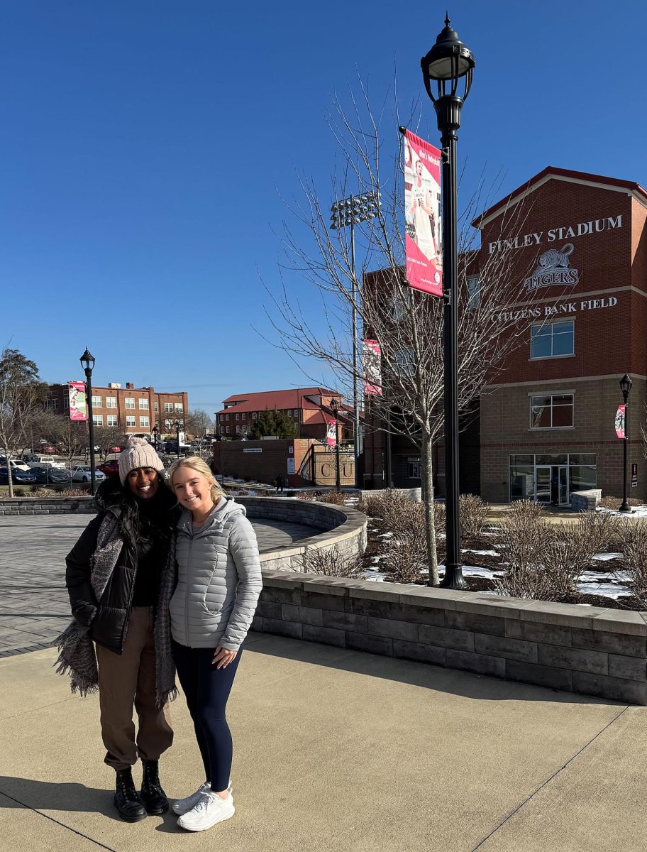 Priya Latchayya, left, shares life-advice with prospective student Lucy during a tour of CU.