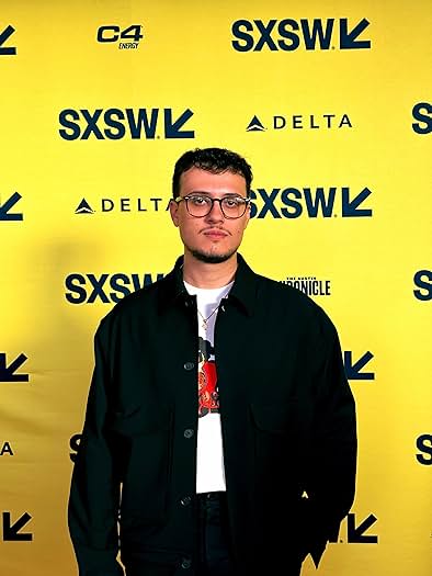 Guilherme Vital poses for a photo on the red carpet at SXSW, representing his latest project, "Bob Trevino Likes It." SXSW stands for South by Southwest. It’s a conference and festival held annually in Austin, Texas. The event celebrates the convergence of interactive, film and music industries.