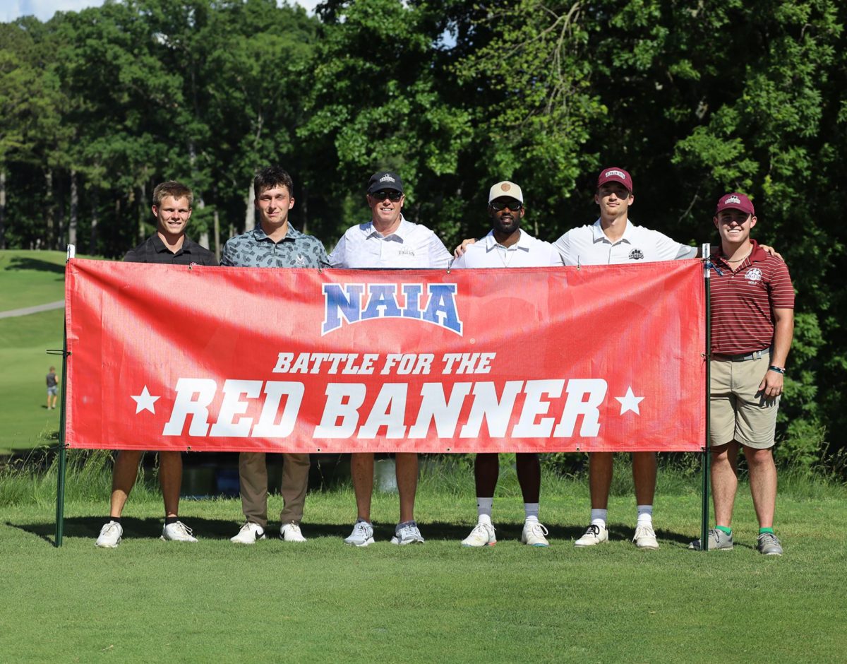 The Campbellsville Tigers golf team takes in the moment at the 2024 NAIA National Championship. Competing in the "Battle for the Red Banner," the team showcases their talent on the national stage. (Photo courtesy of CU Sports Information)