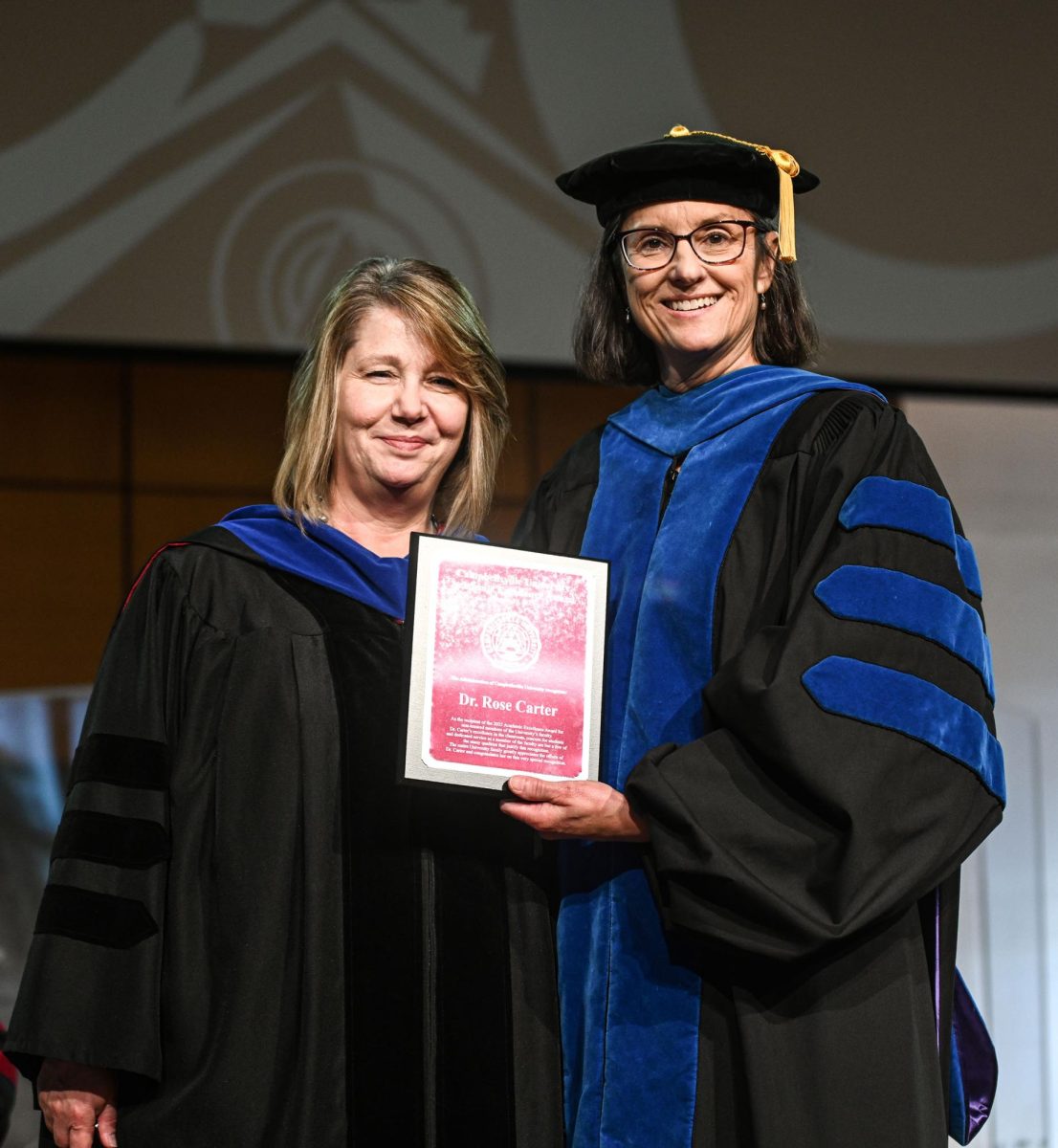 Dr. Rose Carter, left, receives the Non-Tenured Faculty Award from Dr. Jeanette Parker, provost and vice president for academic affairs.