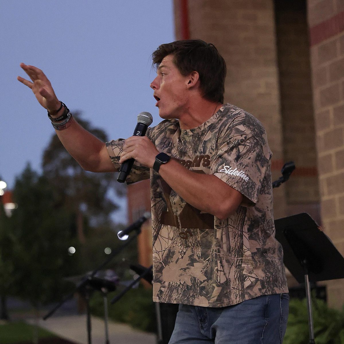 Zeke Carwile, a Campbellsville University student and avid FCA participant, speaks passionately about his faith during the annual Fields of Faith event on campus. (Photo by Brett Pierce)