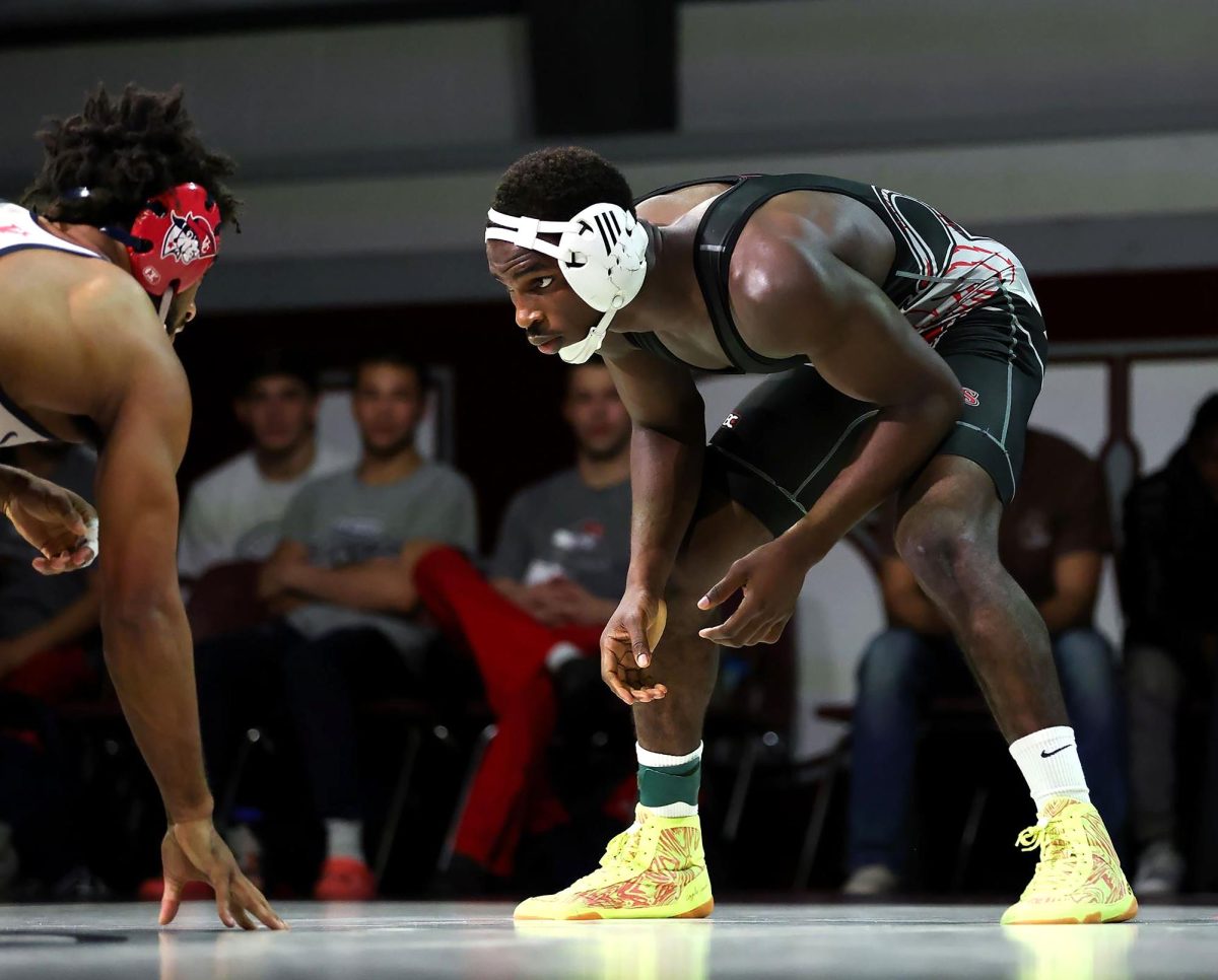 Jasitin Kubwimana wrestles for Campbellsville University during a match against the University of the Cumberlands in the 2024–25 season. (Photo courtesy of CU Sports Information)